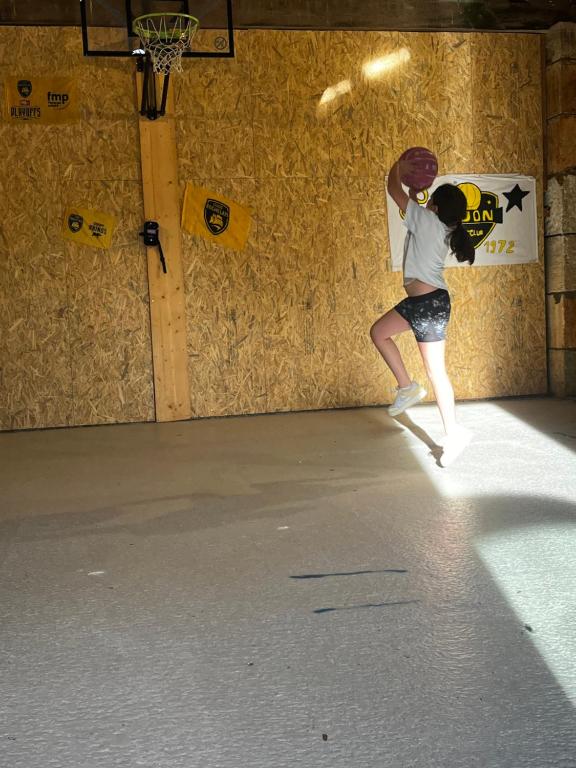 a girl is doing a trick on a skateboard at La plage et le calme in Marennes