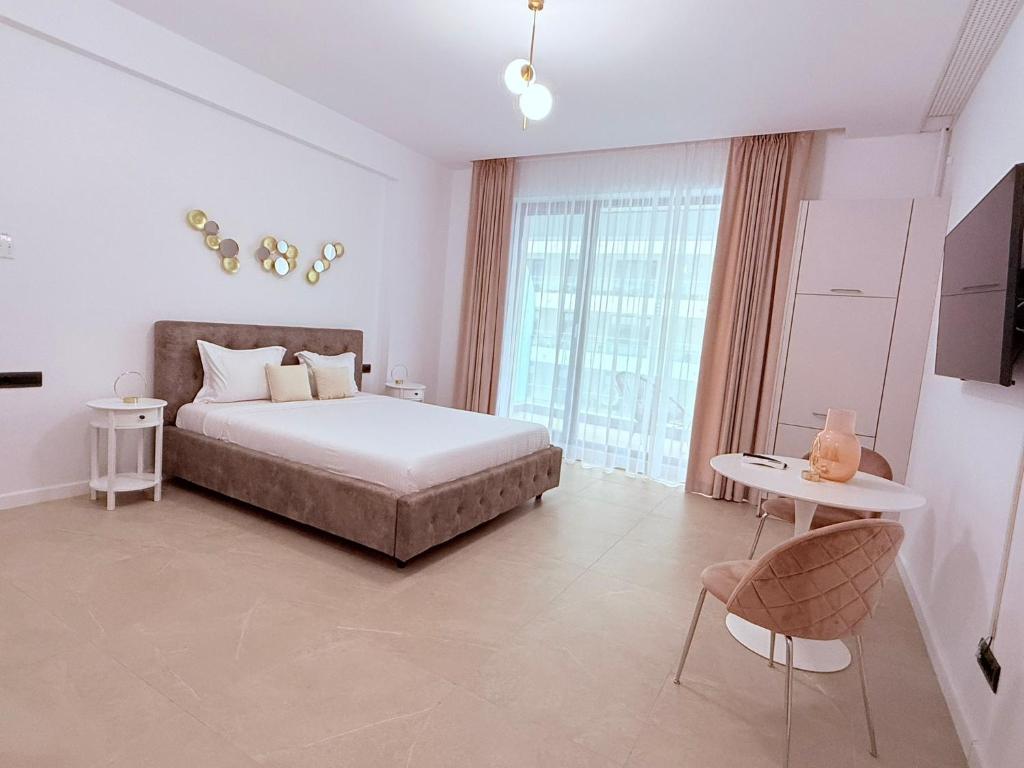 En eller flere senge i et værelse på Holidays Sea Vibes One