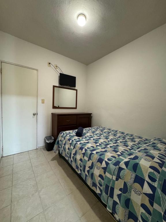 Ένα ή περισσότερα κρεβάτια σε δωμάτιο στο Hotel 8 leguas