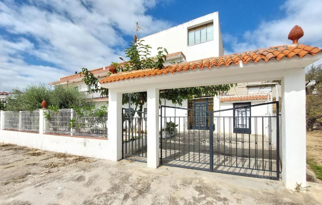 a gate in front of a house at Casa Traiguera in Traiguera