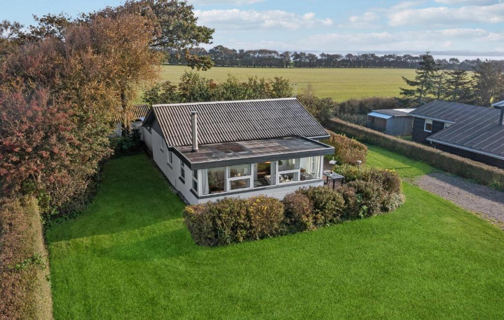 an overhead view of a small house on a lawn at Amazing Home In Snedsted With Wifi in Skyum