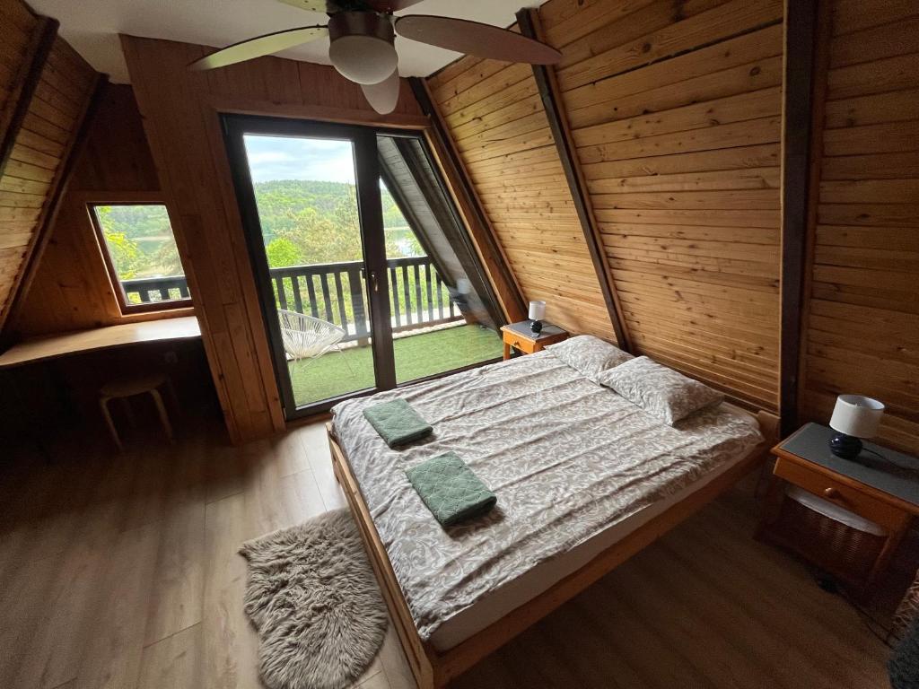 Postel nebo postele na pokoji v ubytování Kaszubskie Letnisko