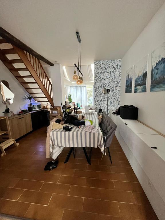 a living room with a table and a couch at Le Luxembourg 1 in Thionville