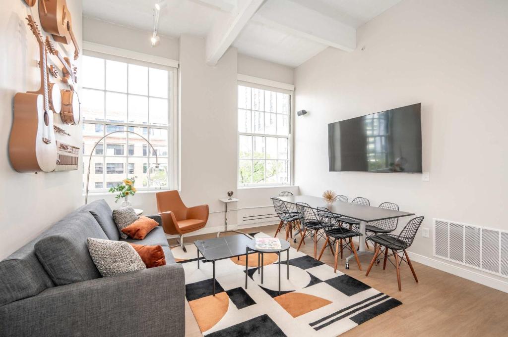 a living room with a couch and a table at The 333 Suites 303 - Suite for 6 in Cincinnati