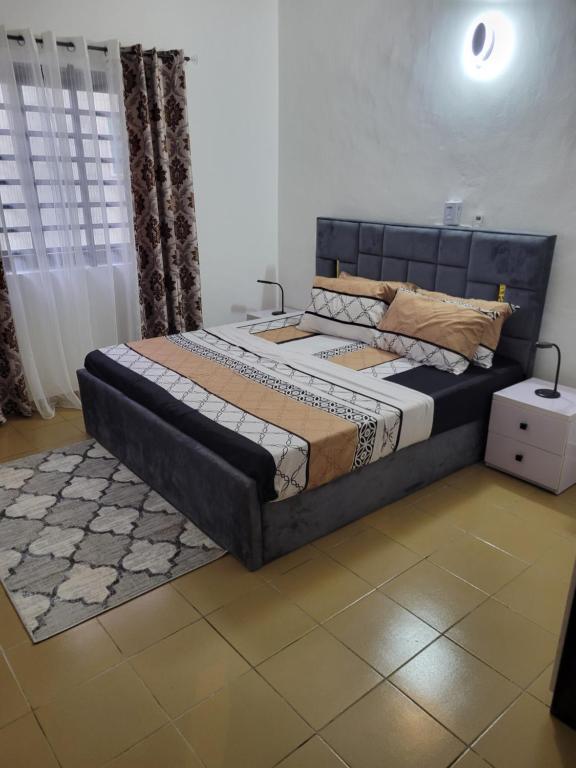 En eller flere senge i et værelse på Résidence Perla