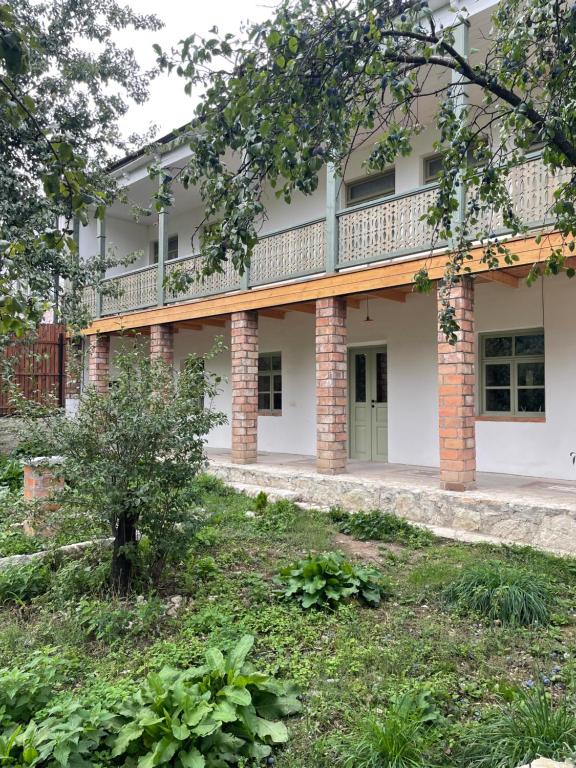 an external view of a building with a balcony at 2 Floor Rustic Inn in Dilijan in Dilijan