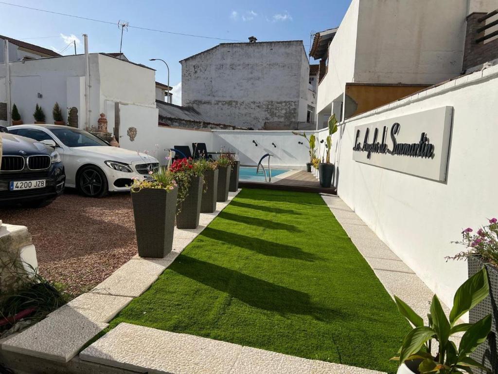a garden with a lawn in front of a building at Los Ángeles de Sanmartín in Jimena de la Frontera