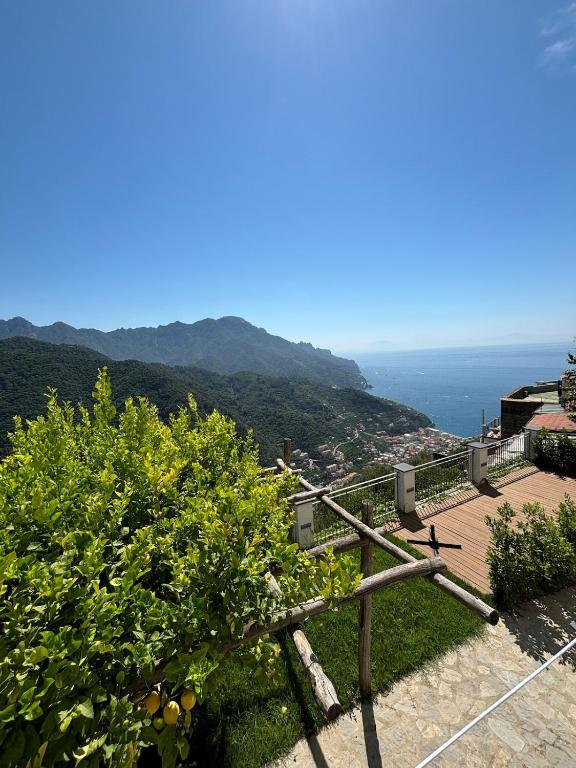 a view of the ocean from a hill with oranges at A Casa di Ilary in Ravello