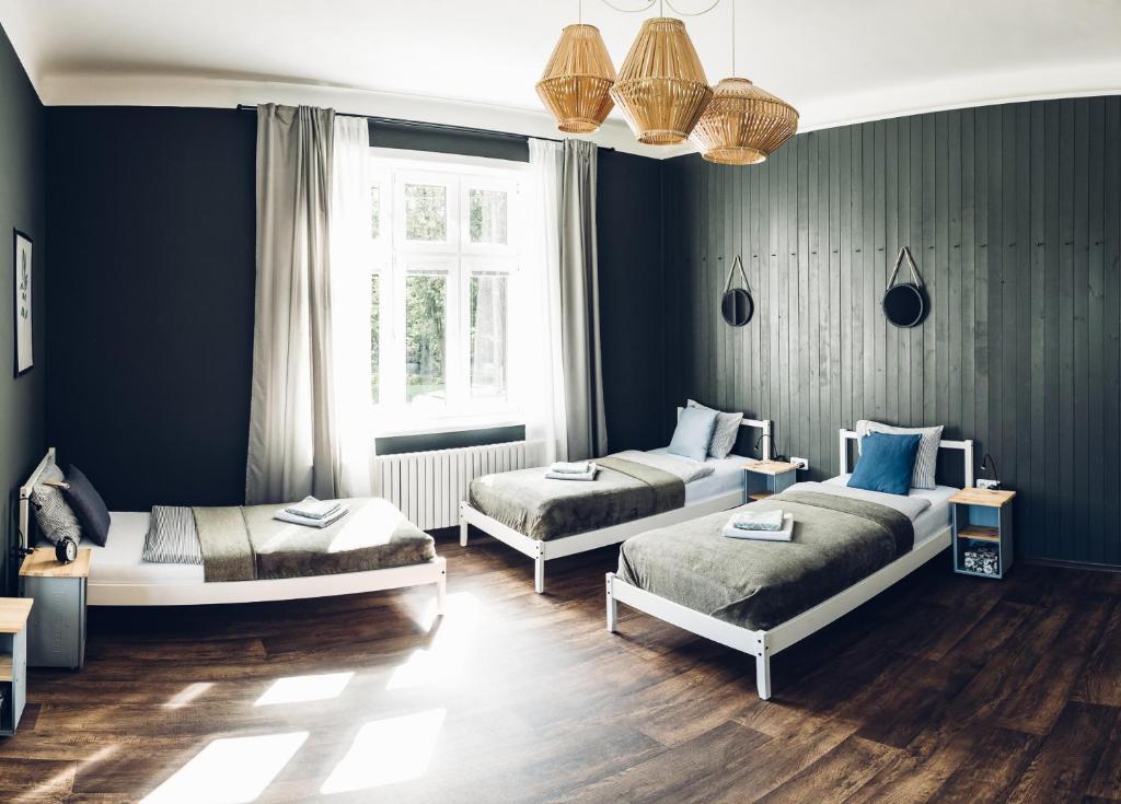 Ένα ή περισσότερα κρεβάτια σε δωμάτιο στο Ubytování Javorka