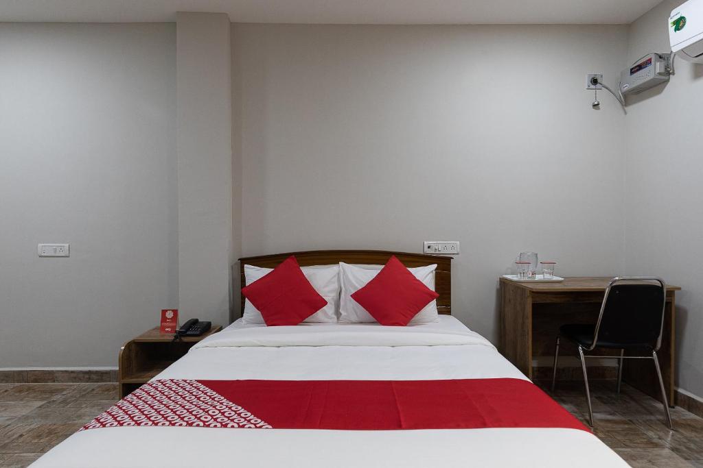 Postel nebo postele na pokoji v ubytování Hotel O Nestle inn