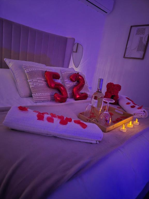 a bedroom with a bed with a number in the middle at Love Room - Cocon Room - Toulon - Ollioules in Ollioules