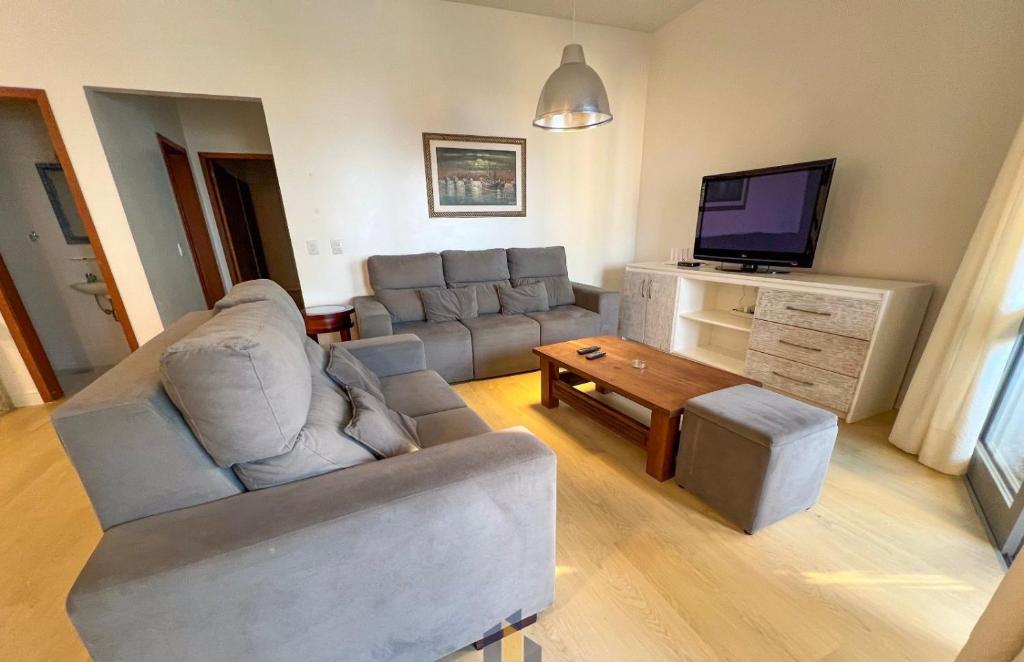 Гостиная зона в Apartamento frente mar com 3 quartos