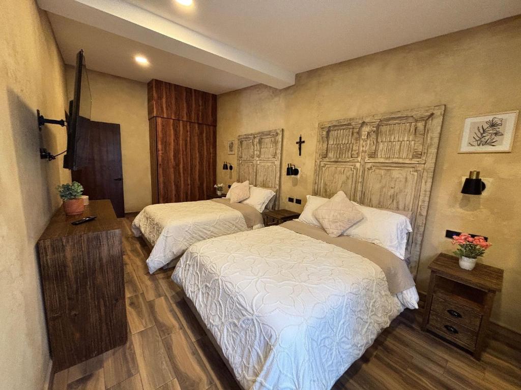 Ένα ή περισσότερα κρεβάτια σε δωμάτιο στο Sasha: Tu refugio fascinante en Val'Quirico.