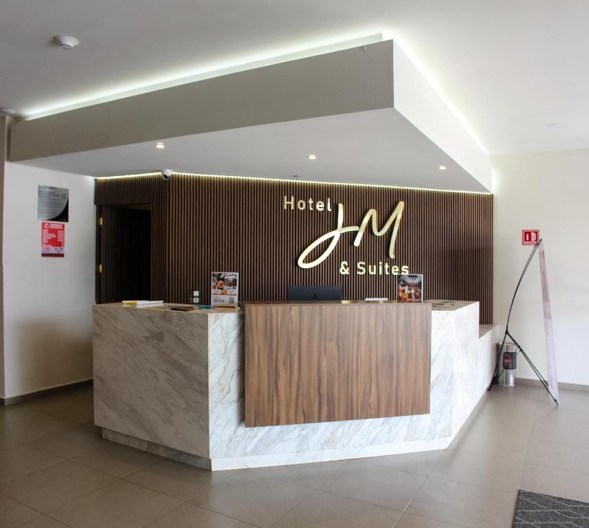 a hotel and suites reception desk in a lobby at JM & Suites in San Luis Potosí