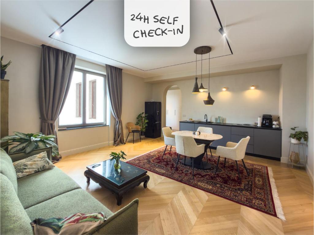 a living room with a couch and a table at Continental Apartment Unirii in Cluj-Napoca