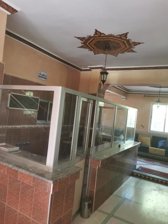 a room with a building with a ceiling at Motel in Oulad Barrehil