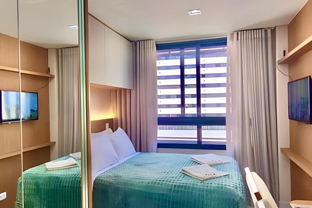 Ένα ή περισσότερα κρεβάτια σε δωμάτιο στο EsTilo & CoNfoRto no Melhor da CiDade c/ PisCiNA