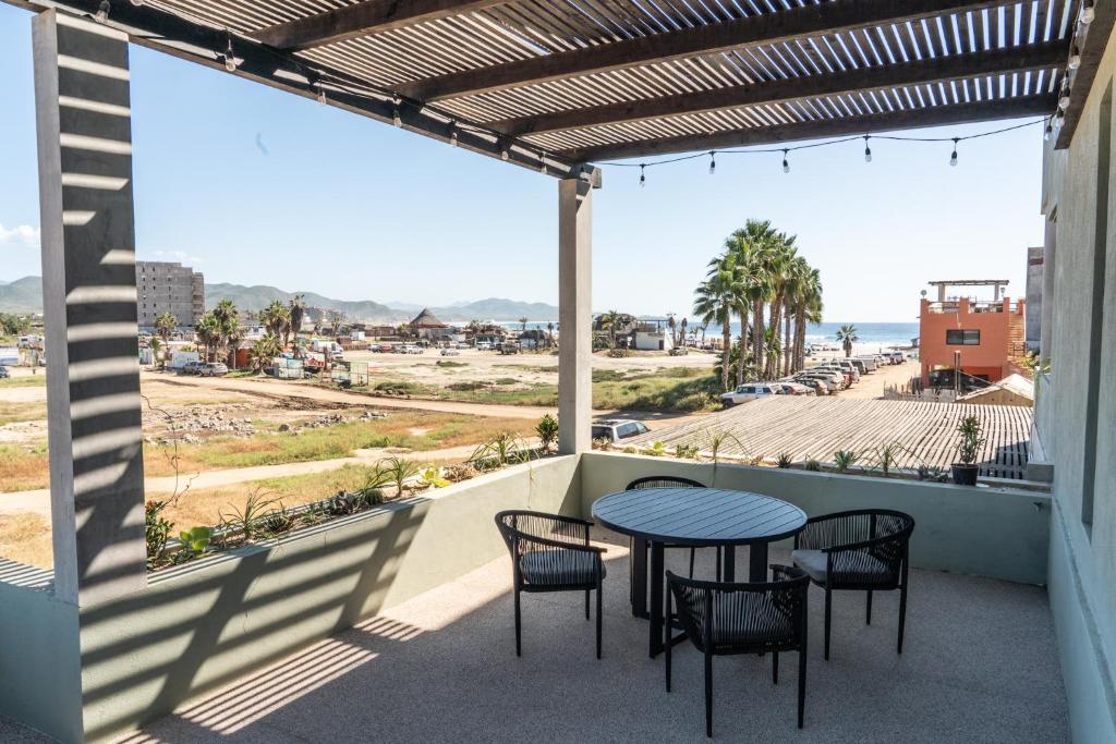 a patio with a table and chairs and a view of the ocean at The Point At Cerritos # 4 in San Carlos
