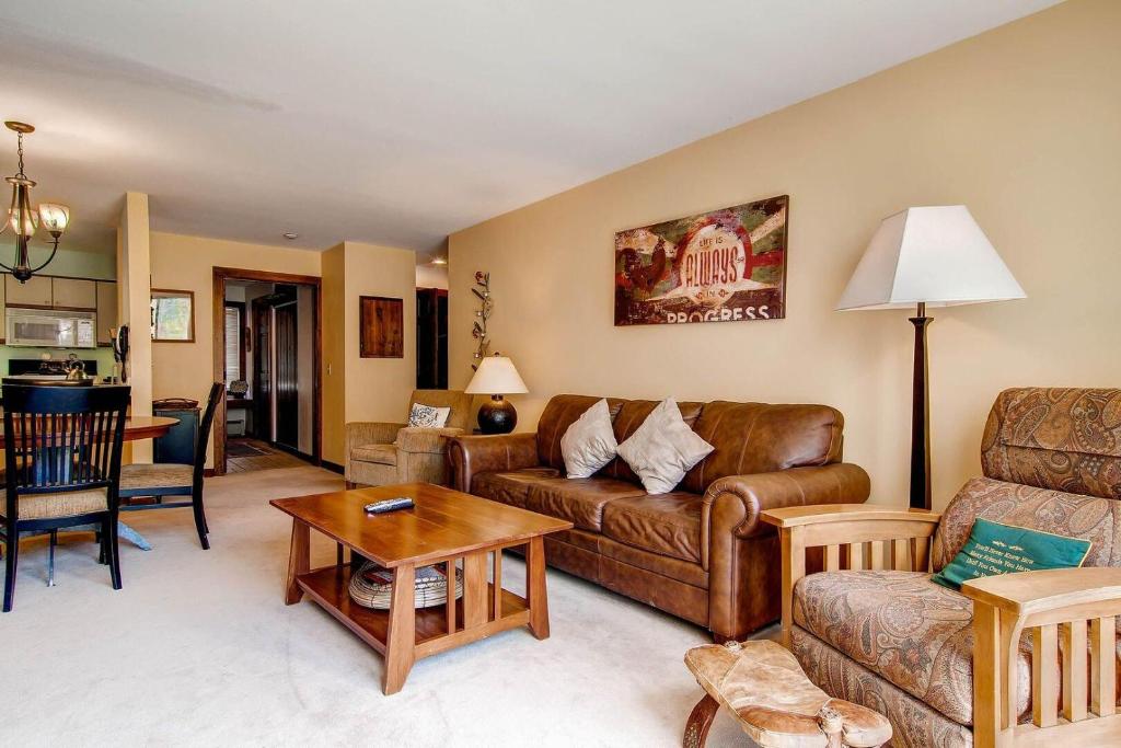 a living room with a couch and a table at Sunrise - W Glade J-1 in Killington