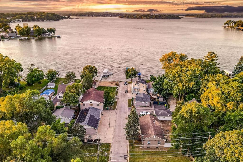 an aerial view of a house by the water at The Main Stay - Mineola Bay Lakeview and Access - Fully Furnished Monthly & Seasonal Rental in Fox Lake in Fox Lake