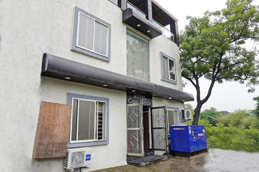 a building with a sign on the side of it at Hotel O CeeRock in Bhopal