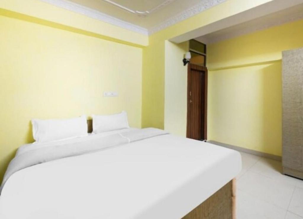 Ένα ή περισσότερα κρεβάτια σε δωμάτιο στο Rinchen Stay