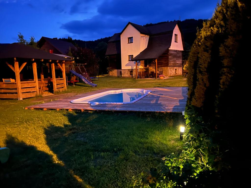 a house with a swimming pool in the yard at Andiamo in Korbielów