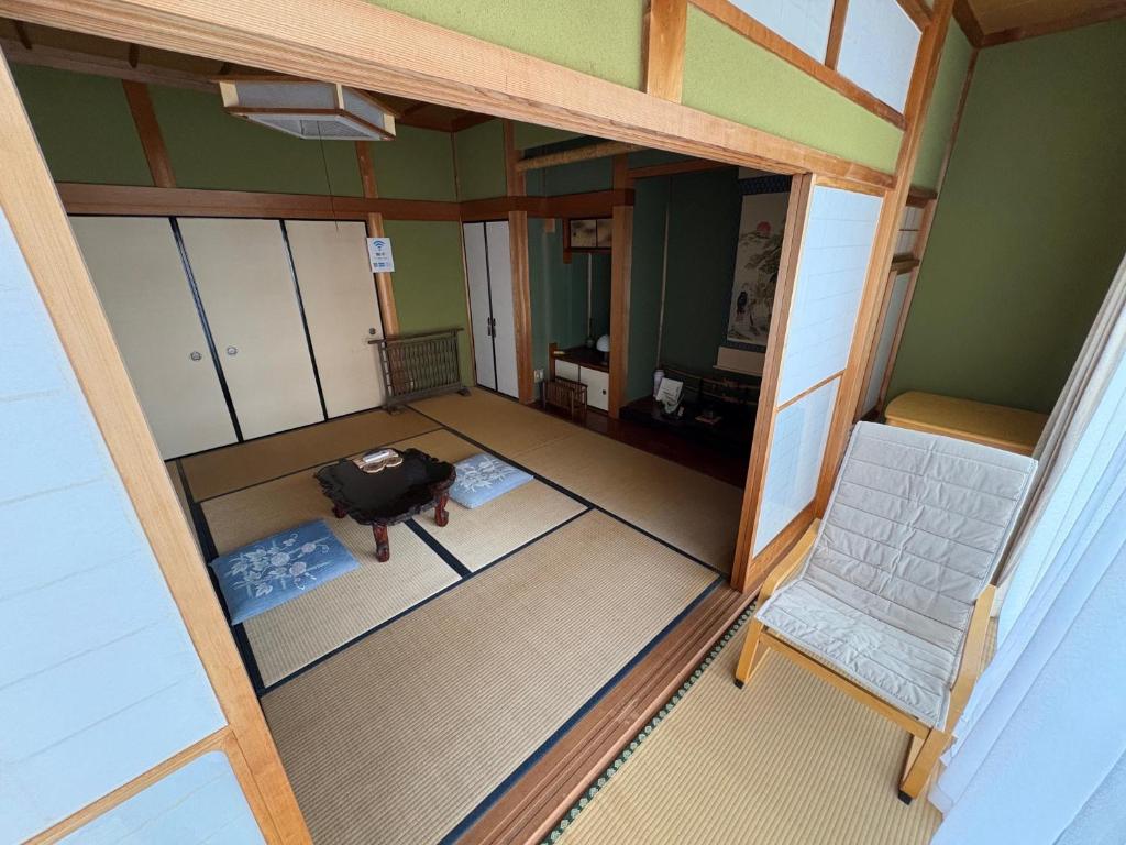 an overhead view of a room with a suitcase and a chair at Kohaku - Vacation STAY 20499 in Nagahama
