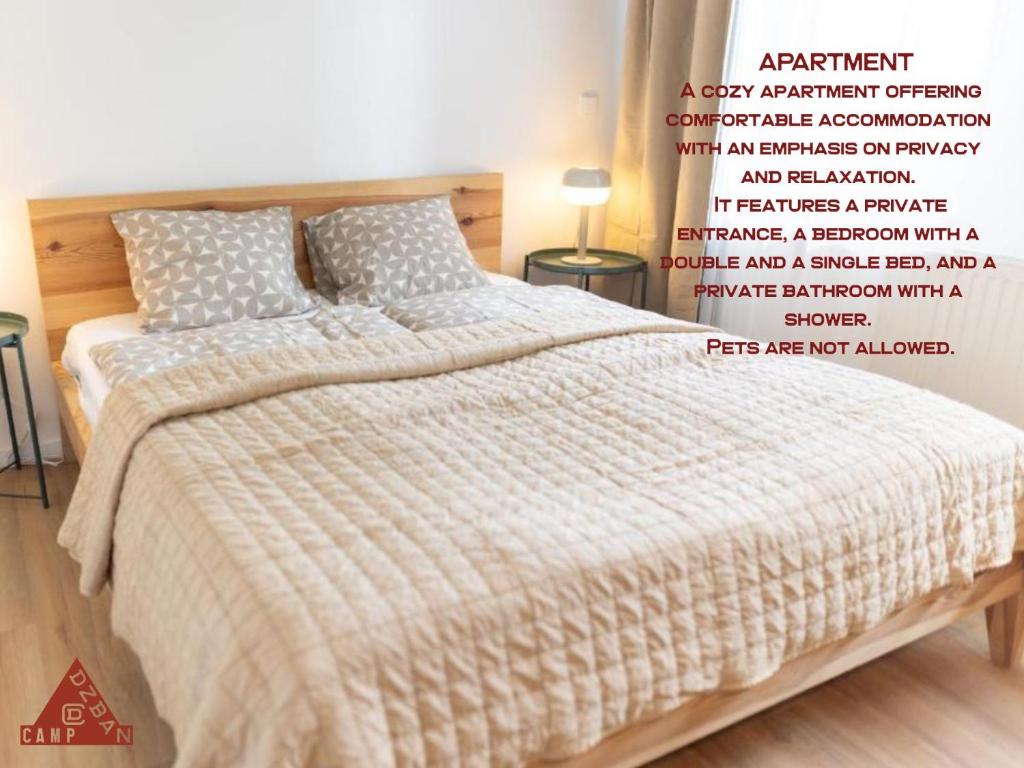 Ένα ή περισσότερα κρεβάτια σε δωμάτιο στο Prague Camping Dzban