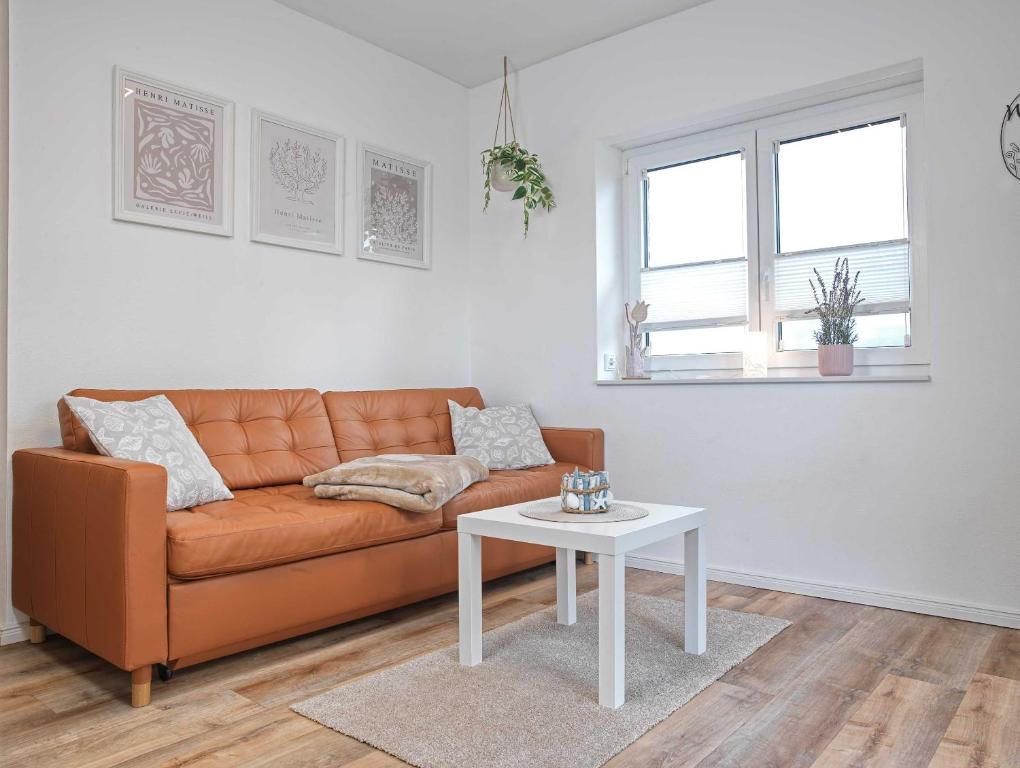 a living room with a couch and a table at Glück Ahoi in Insel Poel
