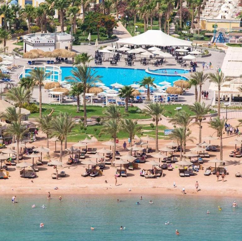 an aerial view of a beach with a pool at Mirage Bay Resort & Aqua Park in Hurghada