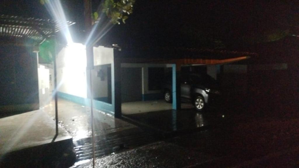 a car parked at a gas station at night at hotel salome in Puerto Triunfo