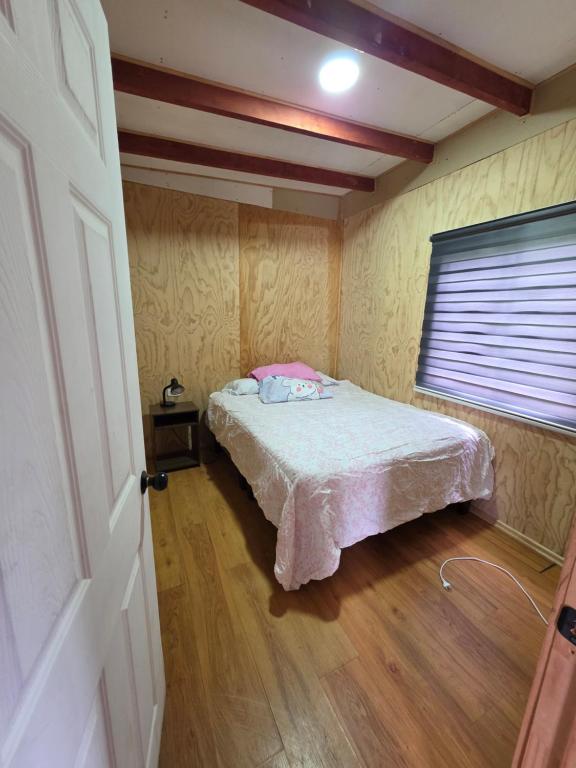 Postel nebo postele na pokoji v ubytování Cabaña Playa Chauquen 2