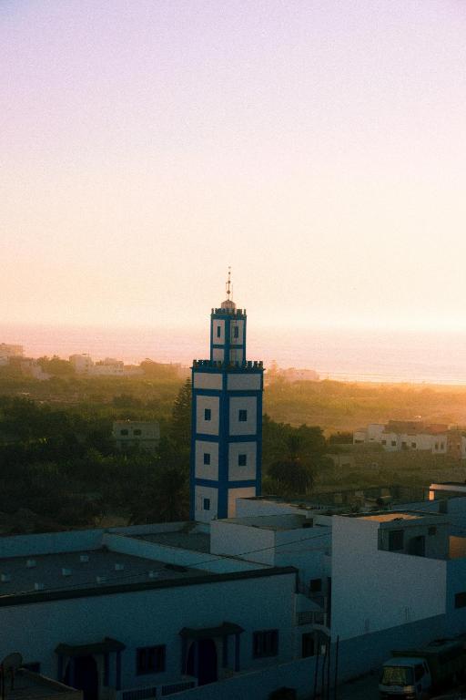 a clock tower sitting on top of a building at Surf Away Morocco in Agadir