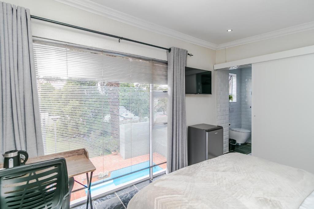 Ένα ή περισσότερα κρεβάτια σε δωμάτιο στο Peace Haven Sandton