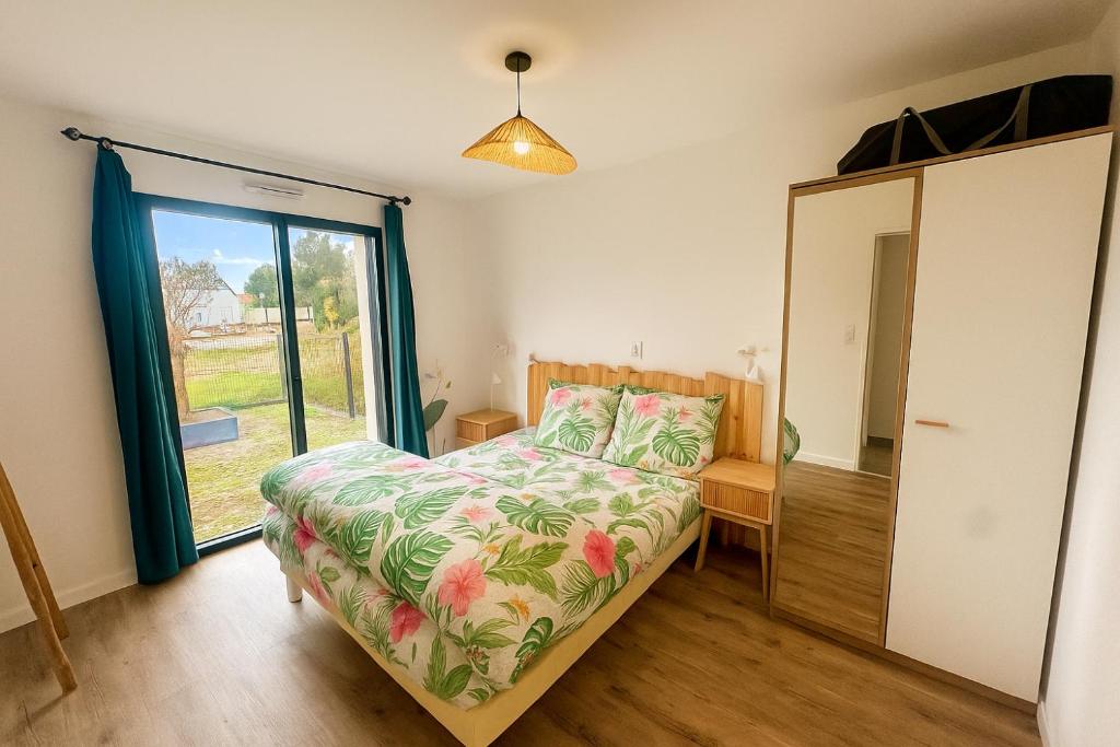 En eller flere senge i et værelse på Le Nid de l'Etier, 4 chambres