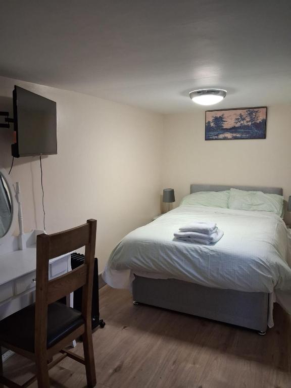 Ένα ή περισσότερα κρεβάτια σε δωμάτιο στο Bedsit in Oldbury