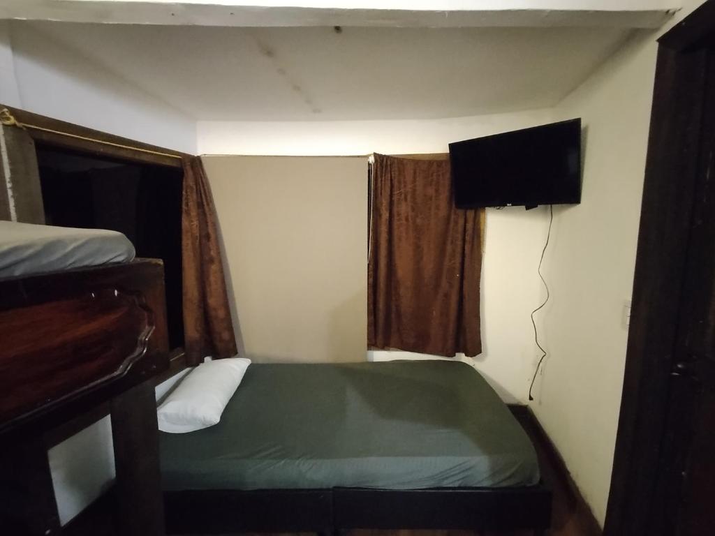 Postel nebo postele na pokoji v ubytování Chalet Acogedor en Combia