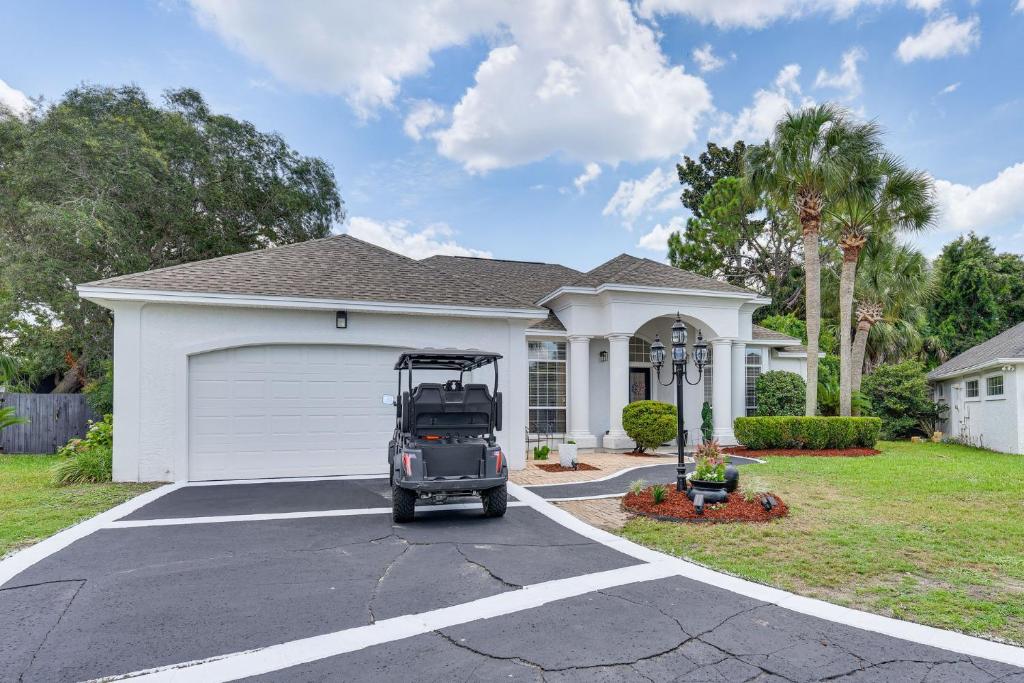 a golf cart parked in front of a house at Edwards' Palace in Panama City Beach