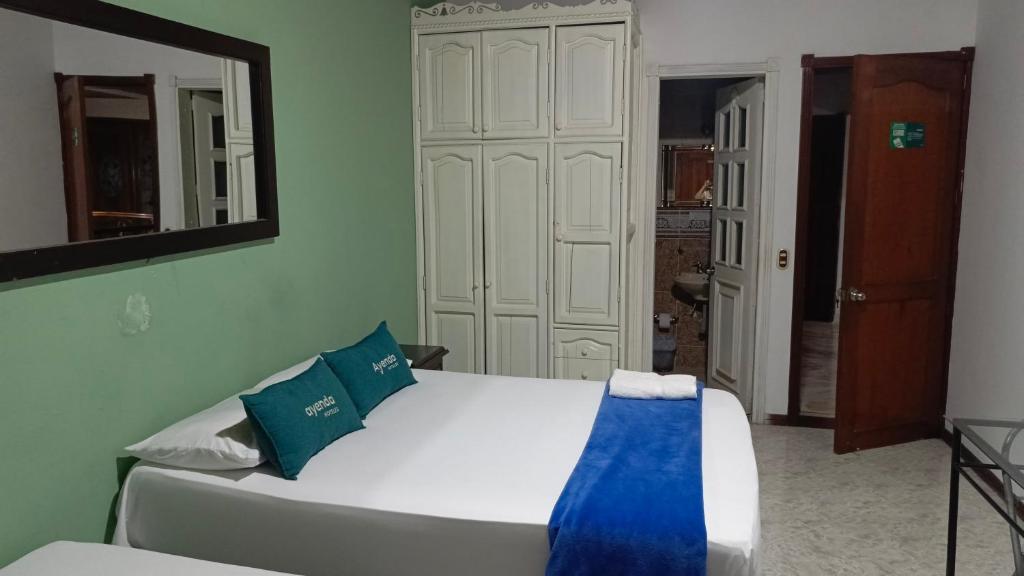 Postel nebo postele na pokoji v ubytování Casa Holistica Cali