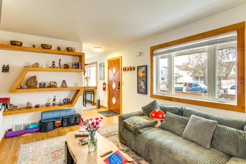 a living room with a couch and a table at 12 Mi to Bozeman Pet-Friendly Gem with Sauna and Yard in Belgrade