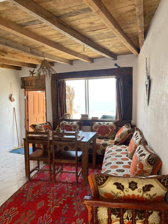 a living room with a couch and a table at TAMRI BEACH HOUSE in Tamri