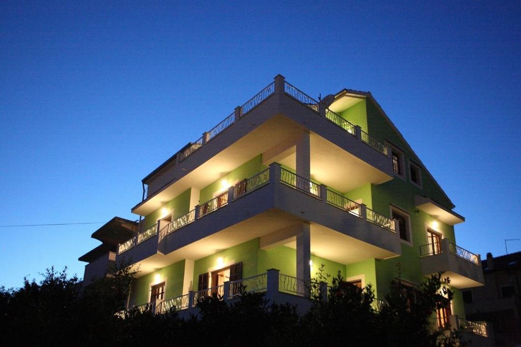 a building with lights on the side of it at Apartments with parking space Vrboska, Hvar - 24967 in Vrboska