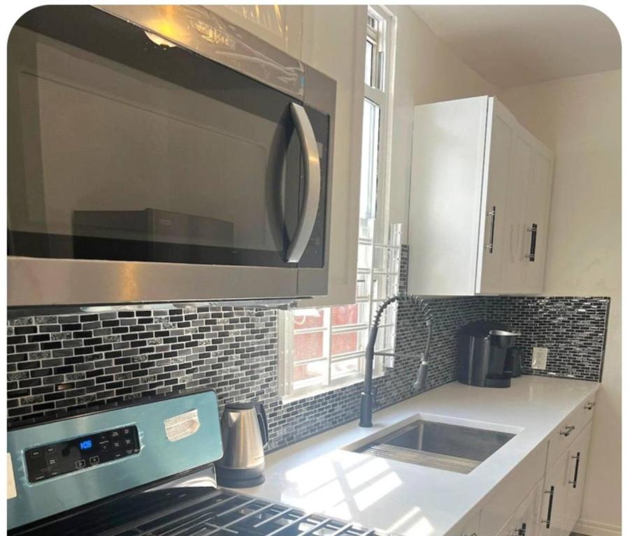 Kuchyň nebo kuchyňský kout v ubytování Eden connect 2bedroom apt