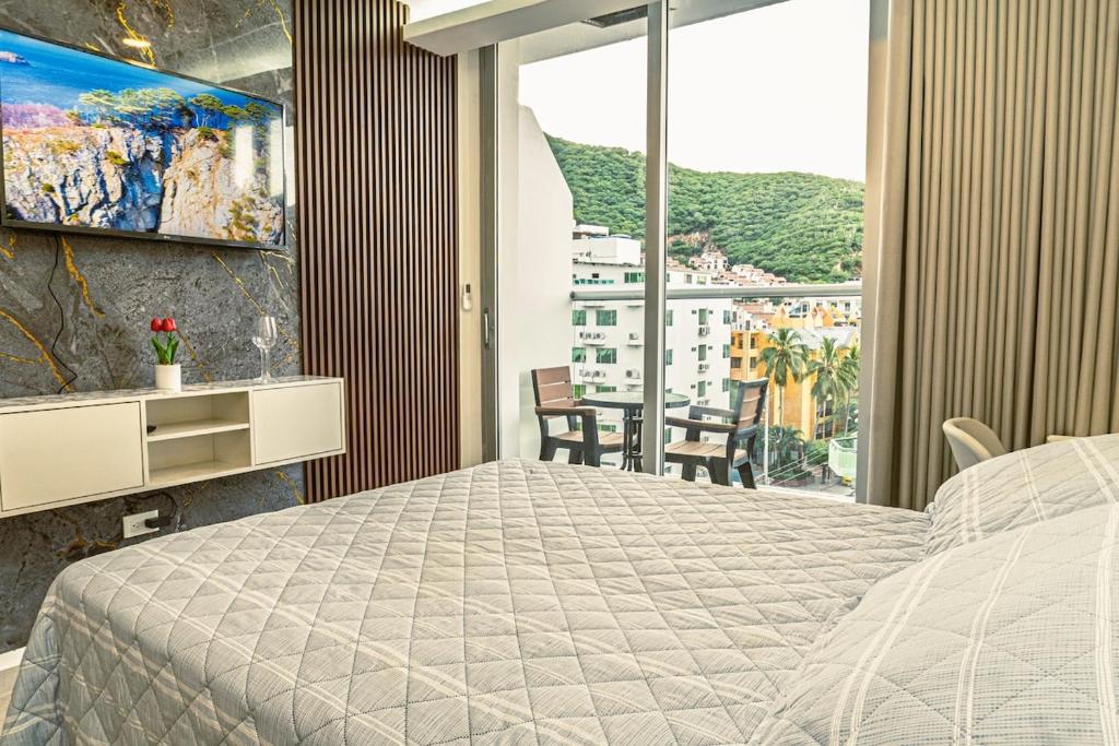 Postel nebo postele na pokoji v ubytování NUEVO!! loft de LUJO en El Rodadero a pasos de la playa