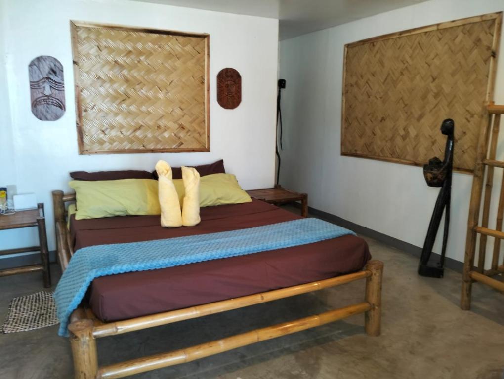 Postel nebo postele na pokoji v ubytování EL Nido Bucana Beach House