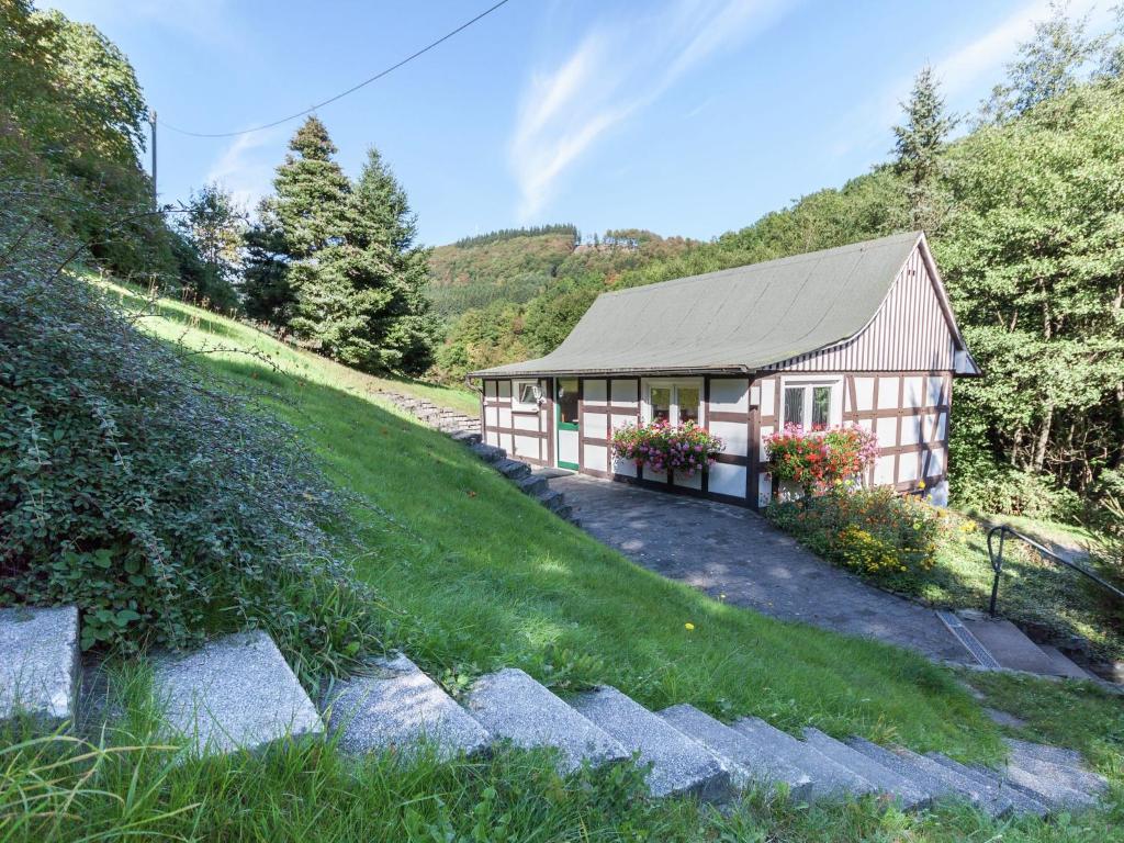a small house on the side of a hill at Ferienwohnung, Oberkirchen in Schmallenberg