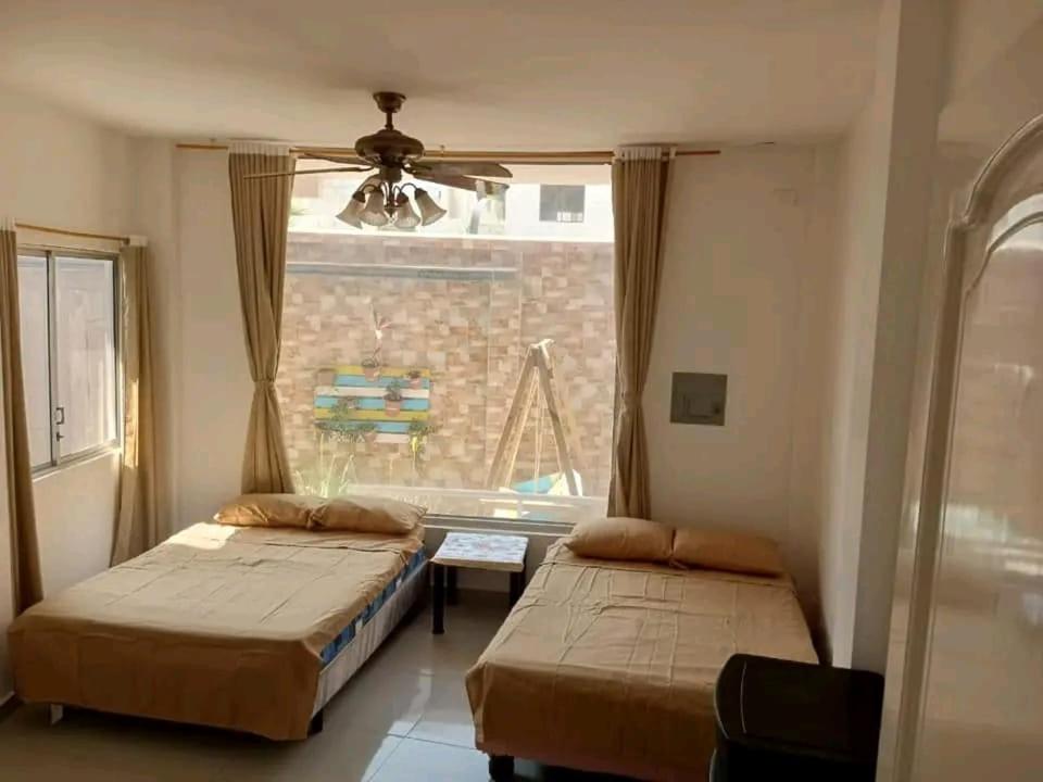 Ένα ή περισσότερα κρεβάτια σε δωμάτιο στο LaManta Departamento