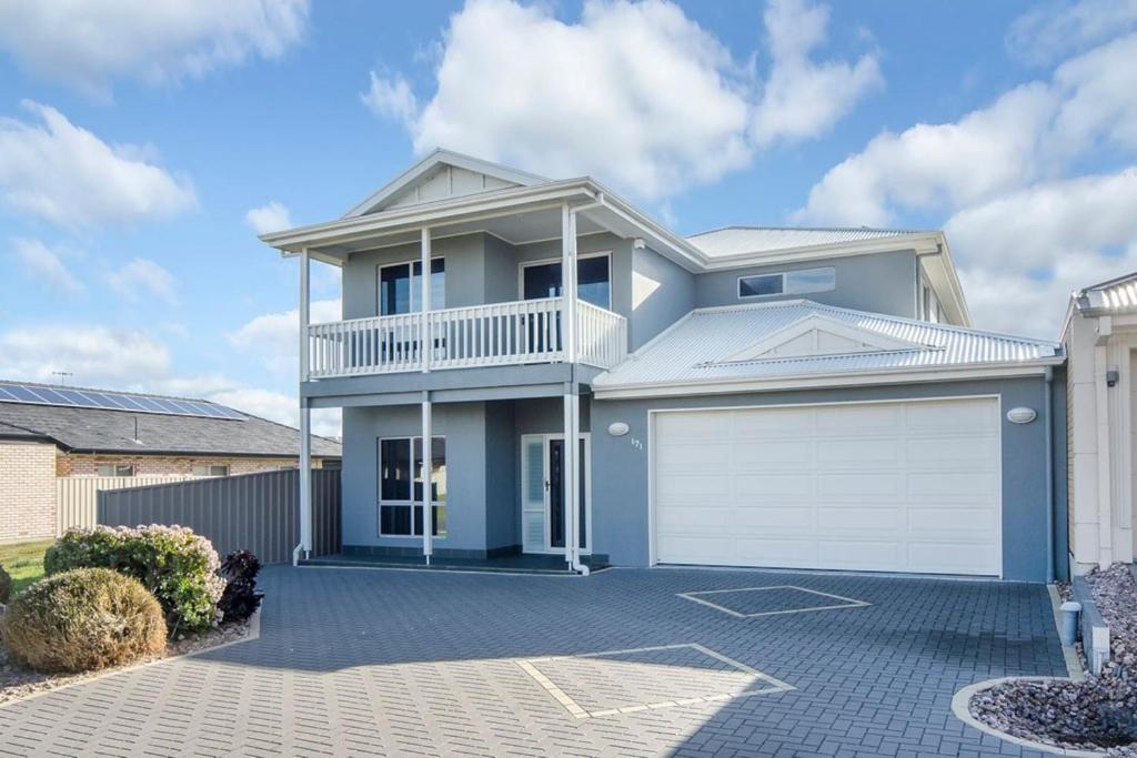 a large white house with a white garage at Isla Bonita - Pet Friendly - Not Fully Fenced - No Linen Included in Hindmarsh Island