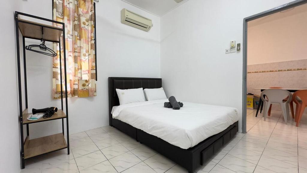 En eller flere senge i et værelse på Senawang Matahari height Best Location